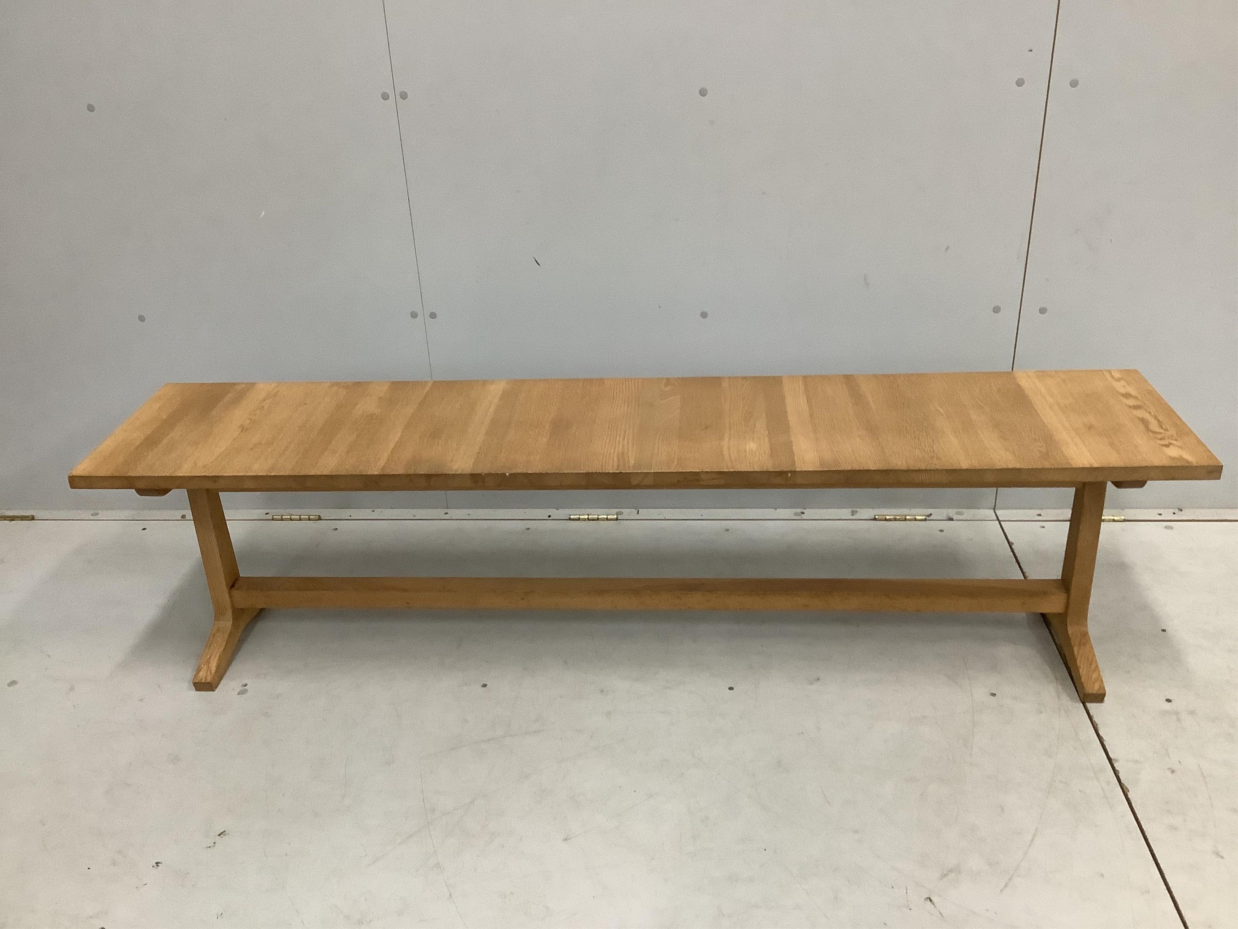 A Contemporary rectangular glass topped shaker style dining table on oak underframe, width 198cm, depth 89cm, height 72cm together with a matching bench seat